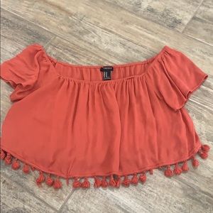 Orange crop top with tassels